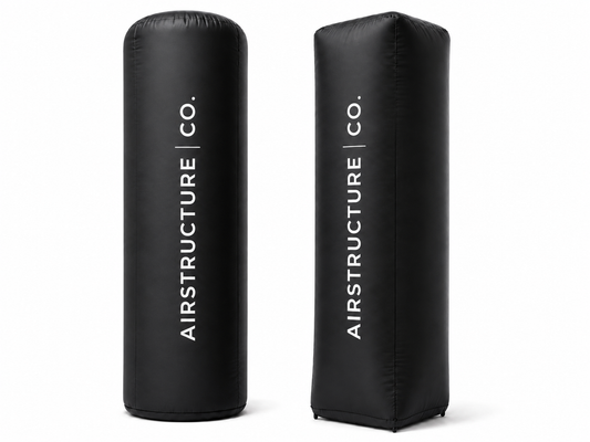 Black custom inflatable branding pillars with vertical AirStructure logo for trade shows brand activations sponsor zones event entrances and promotional displays