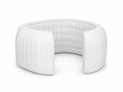 White custom inflatable trade show lounge pod with curved semi-enclosed walls and integrated seating for client meetings and sponsor lounges